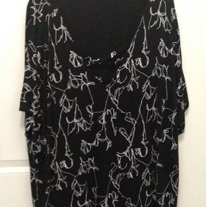 Peekaboo type black floral fashion top